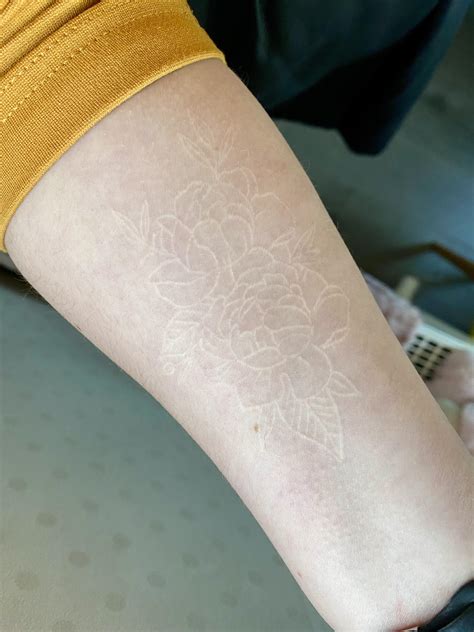 healed white ink tattoo.